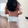A new cross-border European and American fashion and shiny evening bag with V-shaped sequins, a clutch and chain single-shoulder crossbody bag details Picture